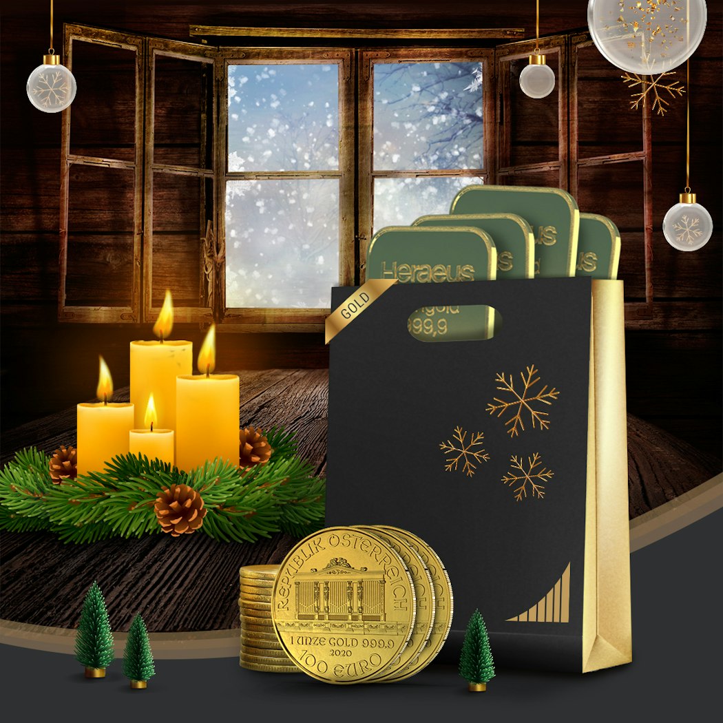 Im Hintergrund sieht man durch ein Fenster den Schneefall. Davor steht ein Weihnachtskranz und daneben eine schwarz, goldene Tüte mit Goldbarren und -Münzen. Schenken Sie Gold zu Weihnachten! Ihr anerkannter Edelmetallhändler Golden Gates.